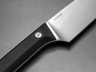 The blade stamp of the black handled Hells Canyon fixed blade knife.