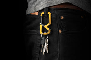 The Bryce Wong artist series Mehlville EDC keychain carabiner hanging from a belt loop with keys attached..