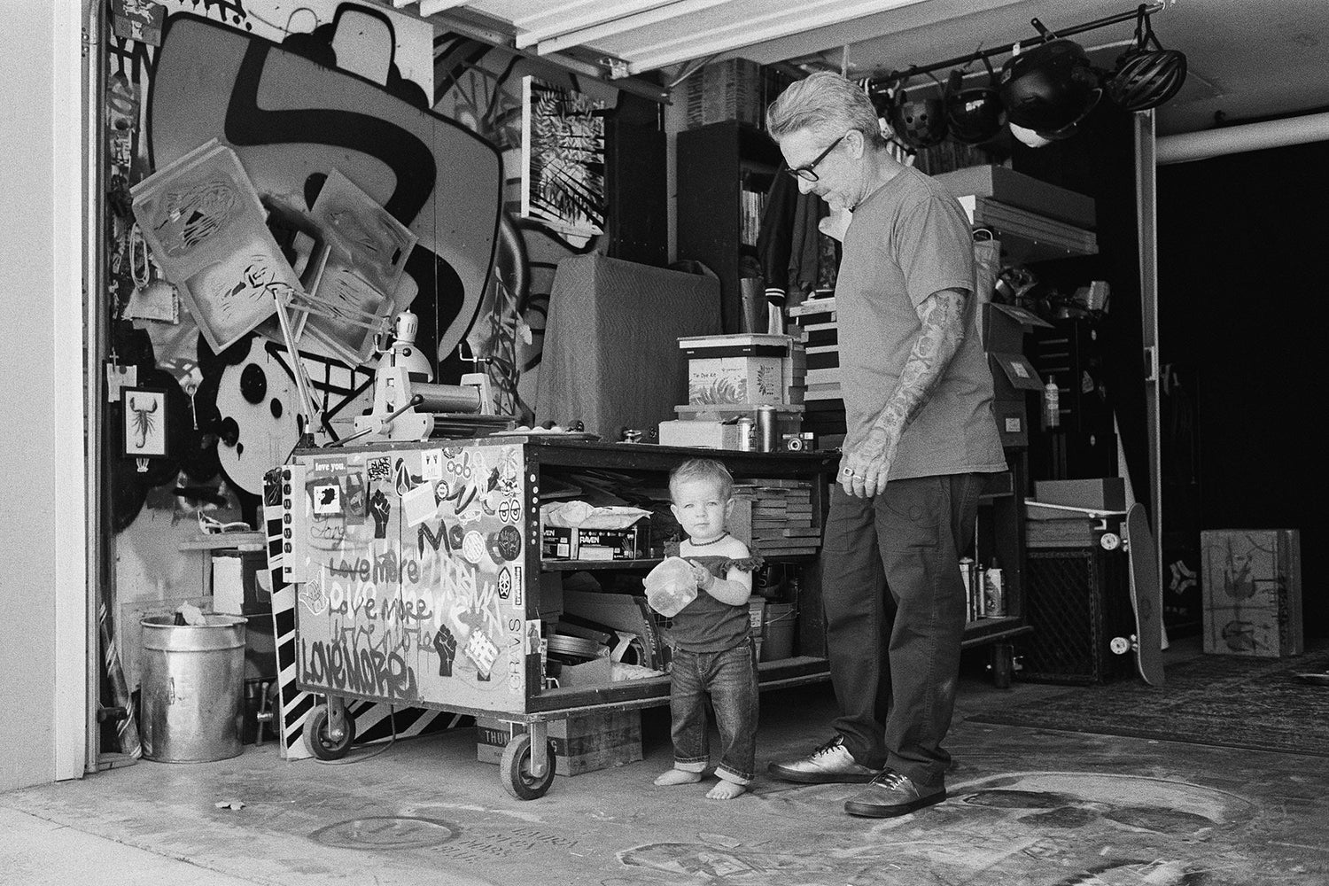 Mark Oblow with his kid in the garage.