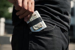 The Lowe minimalist card holder wallet in silver and black in pocket.