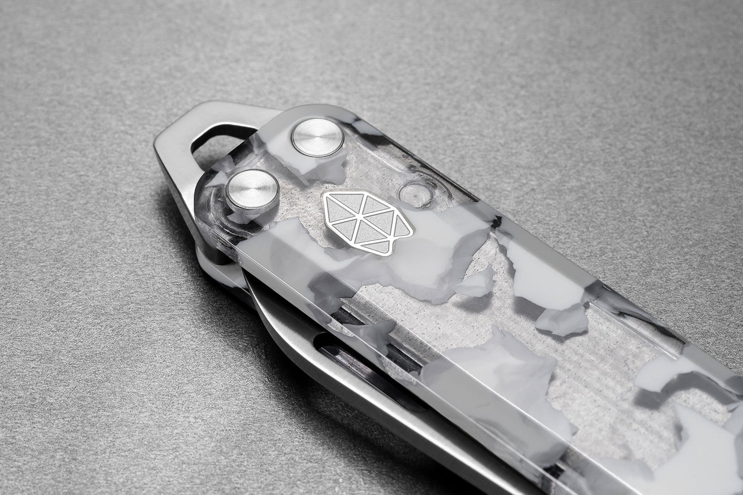 The pry bar of The Elko EDC keychain folding pocket knife with eco acetate scales.