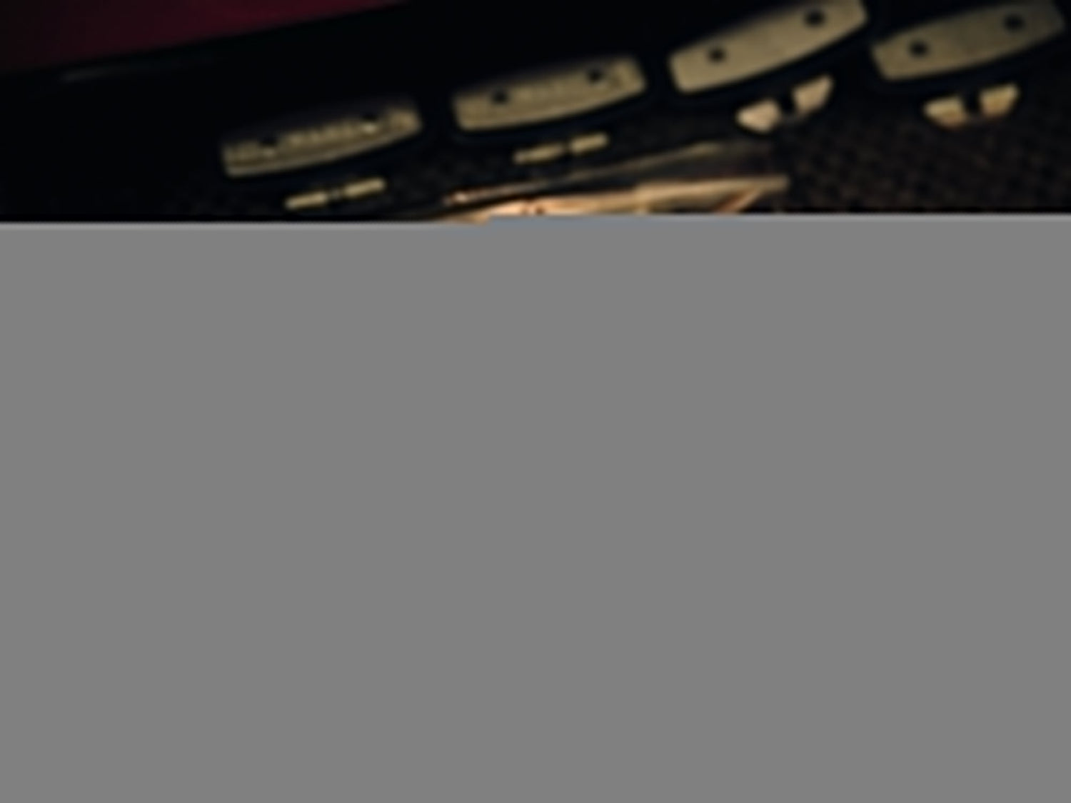 A black Chapter EDC folding frame lock pocket knife next to barber Paul Hewitt's tools.