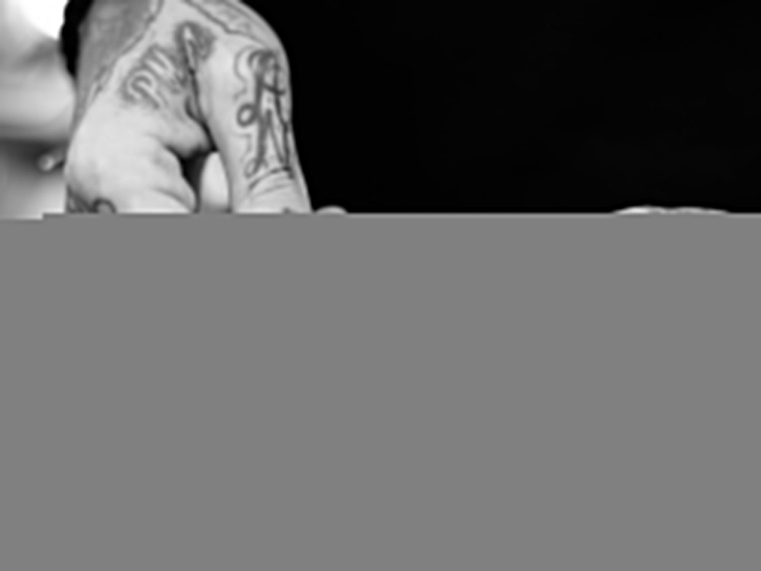 Professional barber Paul Hewitt adjusting the strap on his watch with the pry bar of his Elko keychain knife.