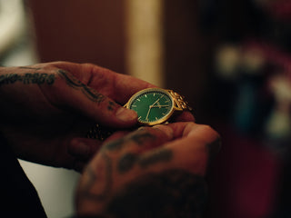Professional barber Paul Hewitt with his watch in hand.
