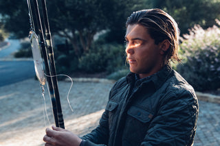 Professional surfer Connor Coffin getting his fishing poles ready.
