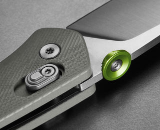 A detail of The Carter EDC slide lock folding pocket knife in primer gray.