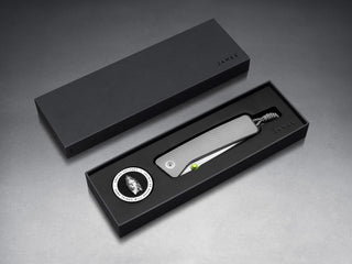 The Barnes integral EDC titanium folding frame lock pocket knife in it's packaging.
