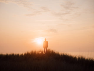 A man enjoying the sunset over the North Sea in Germany.