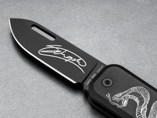 The James Brand and Schoph collab Elko EDC keychain pocket knife with a signed blade.