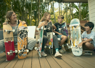 A group of kids with skateboards they are donating for Giving Tuesday.