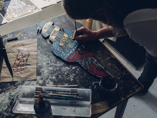 UK artist Schoph Schofield putting the final touches the James Brand collaboration poster.