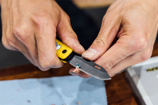 Artist Bryce Wong sharpening a pencil with his James Brand artist series pocket knife.