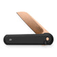 The Wells EDC button lock folding pocket knife in rose gold and black.