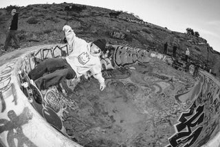 Professional skateboarder Zach Miller riding in the Nude Bowl pool.