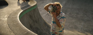 Professional skateboarder and photographer Arto Saari taking a photo.