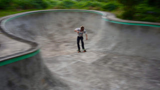 Professional skateboarder and photographer Arto Saari skating a pool in Hawaii.