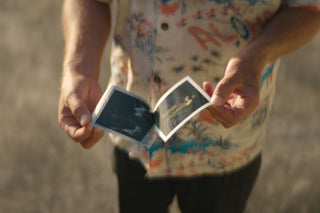 Professional skateboarder and photographer Arto Saari exposing a polaroid picture.