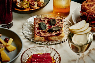A table of food and cocktails.