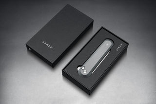 The made in the USA Wells EDC button lock folding pocket knife in raw aluminum and Magnacut steel in box. 