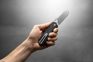 The Folsom Pro EDC pocket knife in a man's hand.