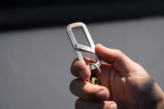 The Madison carabiner closed in hand.