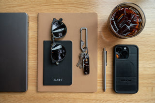The Elko EDC keychain folding pocket knife with eco acetate scales with other EDC gear on a table.
