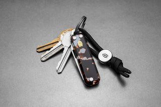 The Elko EDC keychain folding pocket knife with eco acetate scales on a keychain.
