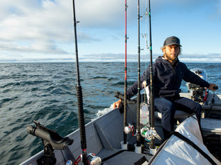 Professional surfer Connor Coffin going fishing in his boat off of Santa Barbara, California.