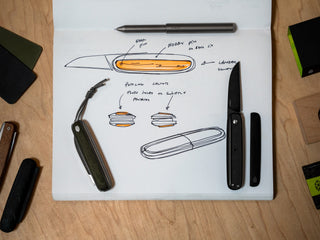 The Pike classic gentlemen's slip joint folding pocket knife resting on sketches of the original concept. 