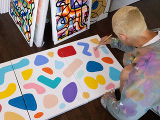 Artist and skateboarder Sebo Walker painting.