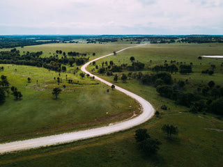 An open road winding through the countryside. 
